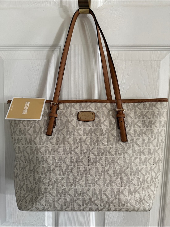 Michael Kors Handbags - Michael Kors Cream Signature MK Tote with tan Leather Trim